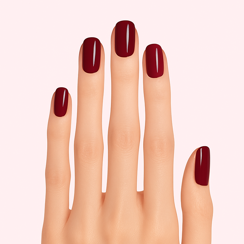 dark red, red wine coloured gel nail stickers on a slender light coloured skin